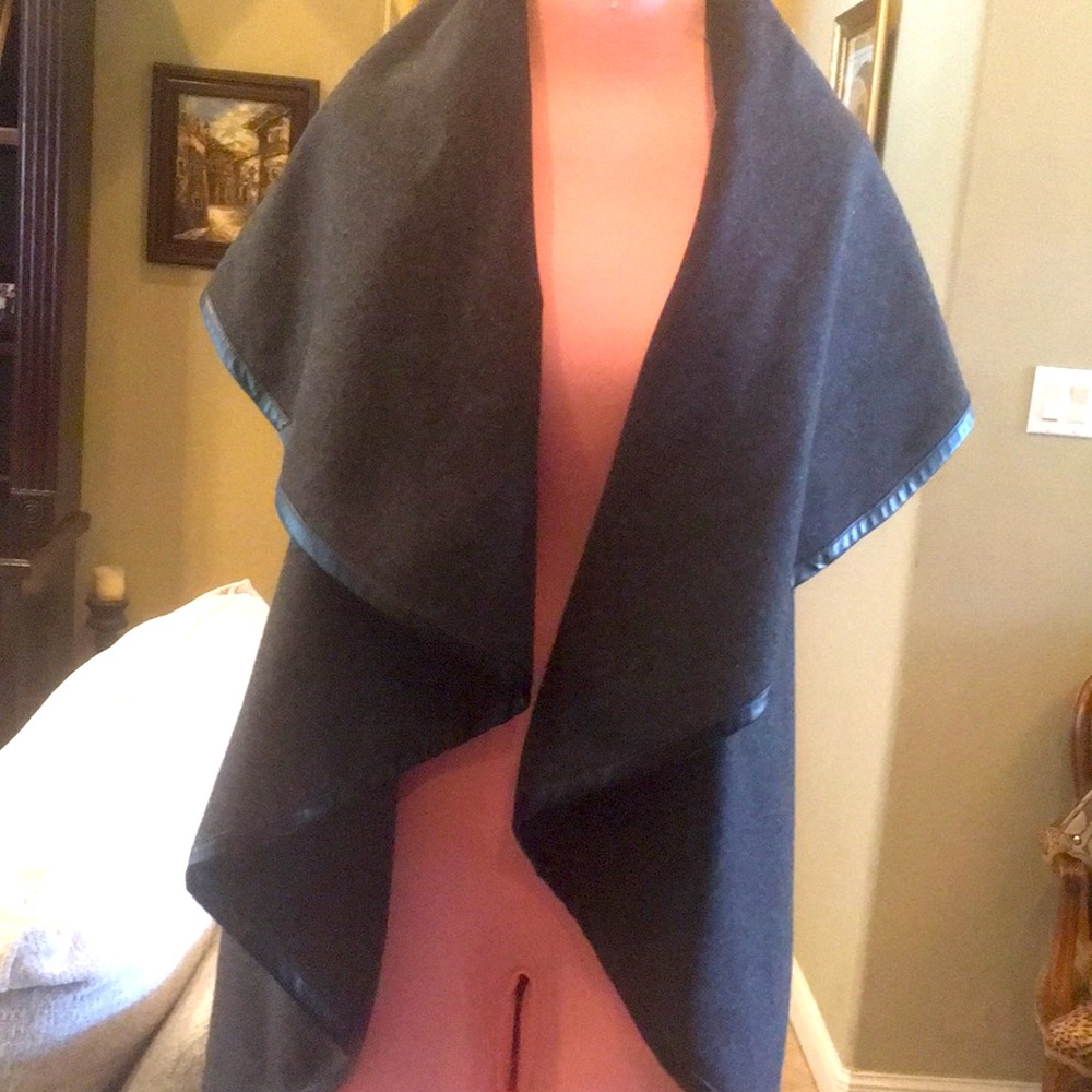 Beautiful Gray poncho wool with leather trim.